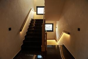 a staircase in a building with a window at BAZ'HUR Boutique Hotel in Kukës