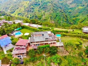 an aerial view of a house in a mountain at Mountain View Hostel in Manizales