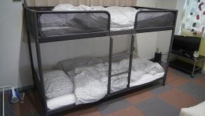 a couple of bunk beds in a room at Space Air Building 3F - Vacation STAY 11441 in Tokyo