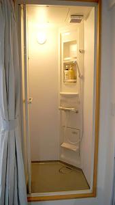 a refrigerator with its door open in a kitchen at Space Air Building 3F - Vacation STAY 11441 in Tokyo