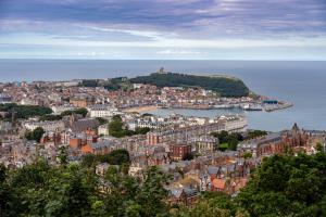an aerial view of a city with a body of water at Sunny View in Scarborough