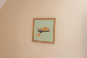 a framed picture of food on a wall at Pinfold Cottage York in York