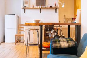 a kitchen with a wooden counter top in a room at Peaceful 1BD Flat with Private Garden Brighton! in Brighton & Hove