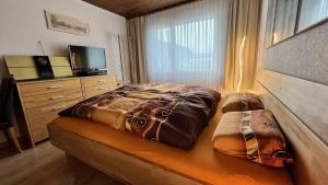 Letto o letti in una camera di Alpenblick Loft neben Skilift in Amden Arvenbüel