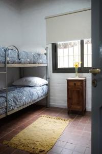 a room with two bunk beds and a window at MARGAHOME in Maipú