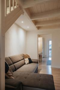 a living room with a brown couch in a room at MOH - Il Maniero in Grottaglie +29 photos