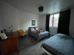 Posteľ alebo postele v izbe v ubytovaní Les Gites d'Albâtre, le 56