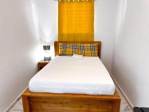 Ένα ή περισσότερα κρεβάτια σε δωμάτιο στο OMERO Ocean Park