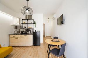 Kuchyň nebo kuchyňský kout v ubytování Le CORALLINE APARTMENTS + 42 fotografií