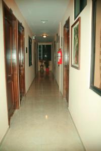 a hallway of a building with a long corridor at Hotel El Ejido in Quito