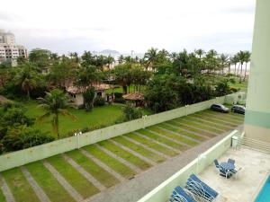 a view from the balcony of a resort at Espaço Sol, Mar & Cia in Bertioga