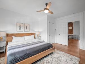 a bedroom with a bed and a ceiling fan at Shadyside, Pittsburgh, Modern and Accessible 2 Bedroom Unit2 with Free Parking in Pittsburgh