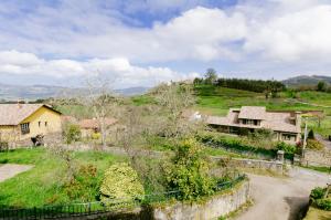 an aerial view of a village with houses on a hill at Fonte San Pedrín in Cajide