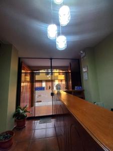 a room with a long counter in a room at Hotel La Villa in Arequipa