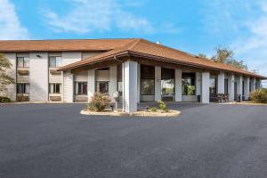 a building with a parking lot in front of it at Quality Inn Ashland in Ashland