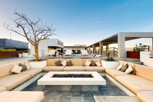 a living room with a couch and a table at CS Downtown Loft CSL in Cabo San Lucas