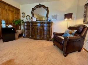 a living room with a chair and a dresser at Sundance Suite - Prairie Rose Bed & Breakfast in Cheyenne +43 photos