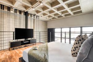 A television and/or entertainment centre at Downtown Loft by ULIV