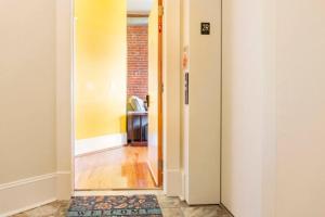 a hallway with a door leading into a room at The Marilyn Monroe Loft. Central Downtown Location in Roanoke