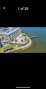a picture of a resort next to a body of water at Boca Ciega Resort in St. Petersburg