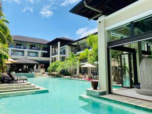 an image of a swimming pool at a resort at 126 Santai - Ground Floor Studio Apartment by uHoliday in Casuarina +2 photos