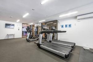 a row of treadmills in a gym at Live Lakeside in an Alfresco Albert Park Retreat in Melbourne