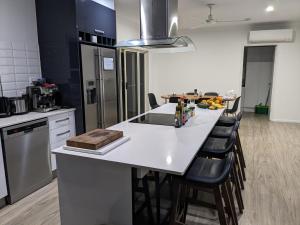 a kitchen with a white counter top and a table at One bedroom in Mount Sheridan in White Rock