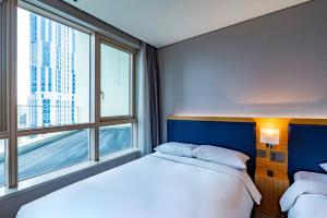 Ένα ή περισσότερα κρεβάτια σε δωμάτιο στο Centum Business Hotel