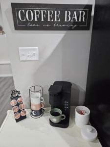 a coffee bar with a coffee maker on a counter at Toe River Retreat in Spruce Pine