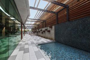 a swimming pool in the middle of a building at Executive Resort-Style Living at Leafy Albert Park in Melbourne