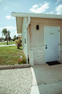 a garage with a white door on a house at VillaBella in Fort Myers