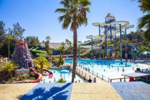 a view of a water park with people in it at Modern Home - Family Fun Hub - Getaway - Billiards By Zen Living Short Term Rental in Glendora