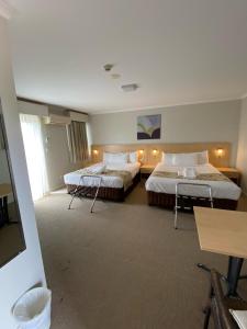 Postel nebo postele na pokoji v ubytování Maitland City Motel + 27 fotografií