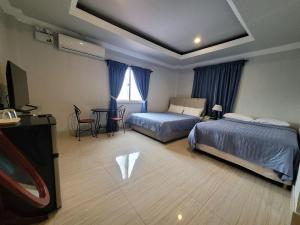 Postel nebo postele na pokoji v ubytování 한라호텔 Halla Hotel
