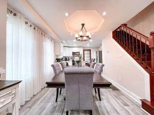 a dining room with a table and chairs at Cheerful & Modern Home w/ a Walkout Deck Area in Glenside