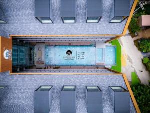 an overhead view of a swimming pool in a building at DAMNERNPAWA in Bang Khon Thi