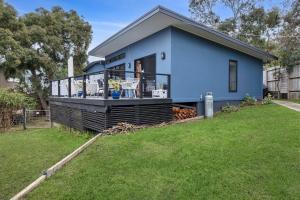 a blue house with a large yard at Blue Haven at Aireys in Aireys Inlet