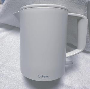 a white coffee cup sitting on the floor at Nissei Hotel Fukuoka in Fukuoka
