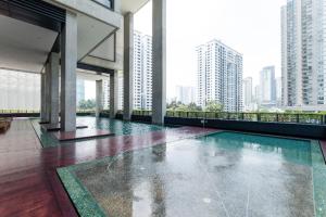 a swimming pool in a building with tall buildings at ARCORIS, MONT KIARA by MK HOME in Kuala Lumpur