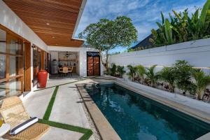 a swimming pool in the backyard of a house at *NEWLY Renovated* 2BD Stylish Villa! in Kerobokan