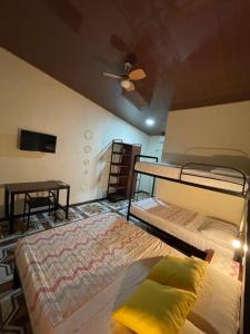 Letto o letti in una camera di POSADA MIRADIA