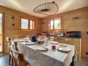 a dining room with a table in a kitchen at Chalet Méribel, 5 pièces, 8 personnes - FR-1-688-64 in Méribel