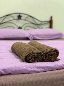 Ένα ή περισσότερα κρεβάτια σε δωμάτιο στο Lala Homestay 2