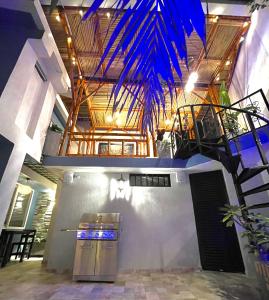 a building with a staircase with blue lights on it at Cal Bed & Breakfast Ibague in Ibagué