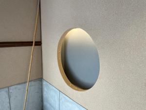 a bathroom with a mirror on the wall at the terrace sumoto - Vacation STAY 24588v in Sumoto