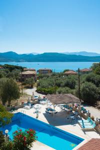 a swimming pool with a view of the water at Marmara Studios in Lygia