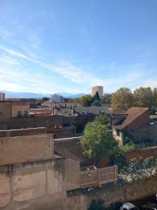 a view of a city with houses and buildings at L'oasis in Tarbes