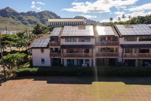 an apartment building with solar panels on it at Ground floor Banyon Harbor in Lihue