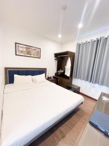 Giường trong phòng chung tại A25 Hotel - 30 An Dương