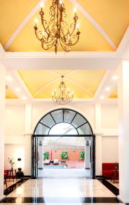 a large lobby with a chandelier and an entry way at Solar Hotel in Siem Reap